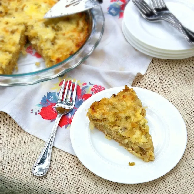Use up your onions and peppers in this savory and cheese pie! Recipe at TeaspoonofSpice.com