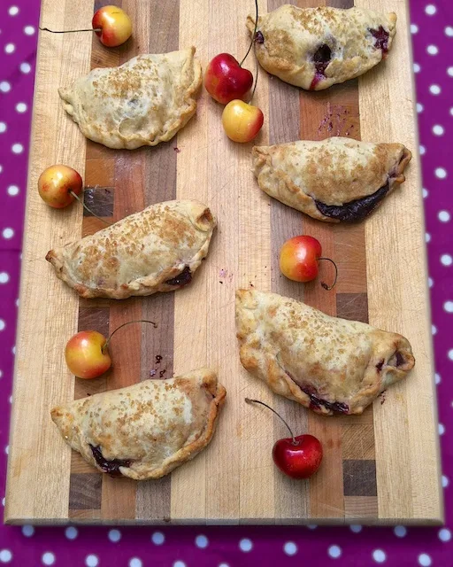 These mini cherry pies are fun to make and have built in portion control! Recipe at Teaspoonofspice.com