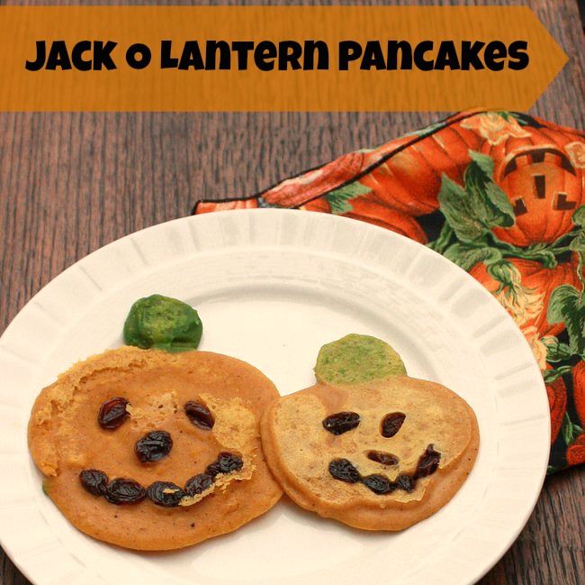 These kid friendly PUMPKIN PANCAKES are perfect for Halloween. Use natural green-pea-dye for the stems | @tspcurry - For more fall time recipes click: TeaspoonOfSpice.com