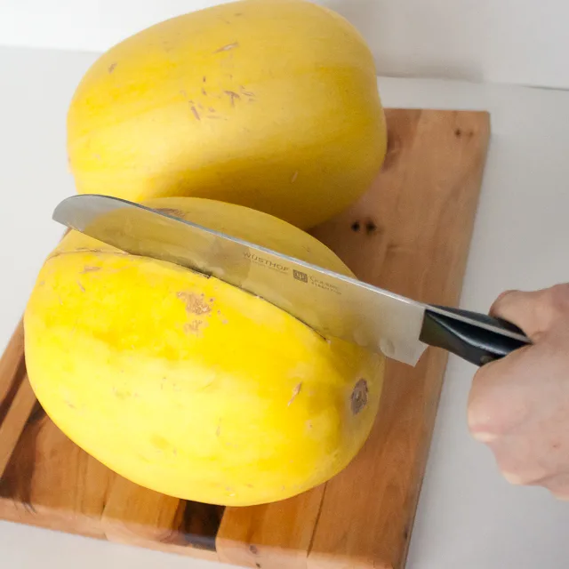 Easily cut through the tough skin of a spaghetti squash | @TspCurry For more #HealthyKitchenHacks - TeaspoonOfSpice.com