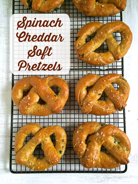 Whole wheat soft pretzels stuffed with spinach and cheddar cheese make for a balanced and satisfying snack.