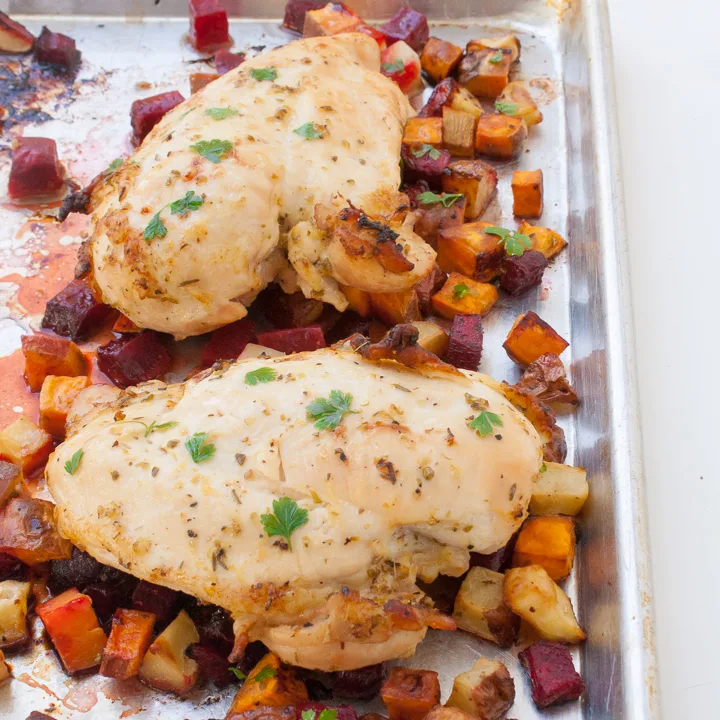 Throw 6 ingredients on a sheet pan and wait for dinner to come out as tender roast chicken and crispy golden veggies: LEMON OREGANO SHEET PAN CHICKEN | @TspCurry #AD For more chicken recipes: TeaspoonOfSpice.com