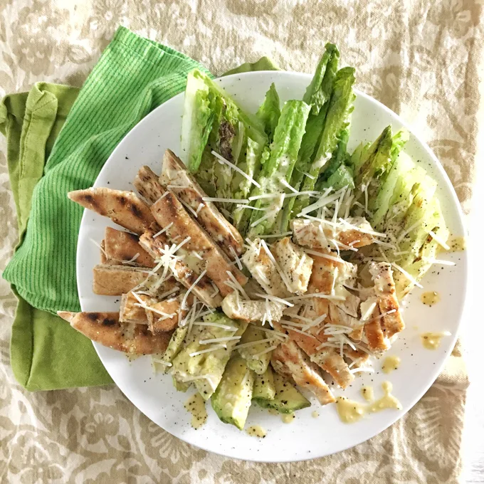 Swap your croutons for grilled pita bread strips with this better-for-you Chicken Caesar Salad. Recipe at Teaspoonofspice.com