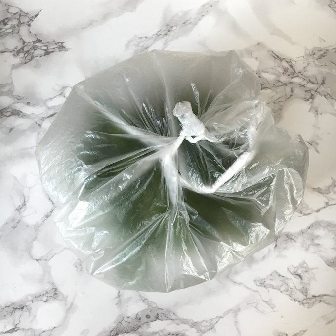 Blow air into your bag of greens before sealing - it will keep them fresher longer! For more Healthy Kitchen Hacks, visit Teaspoonofspice.com