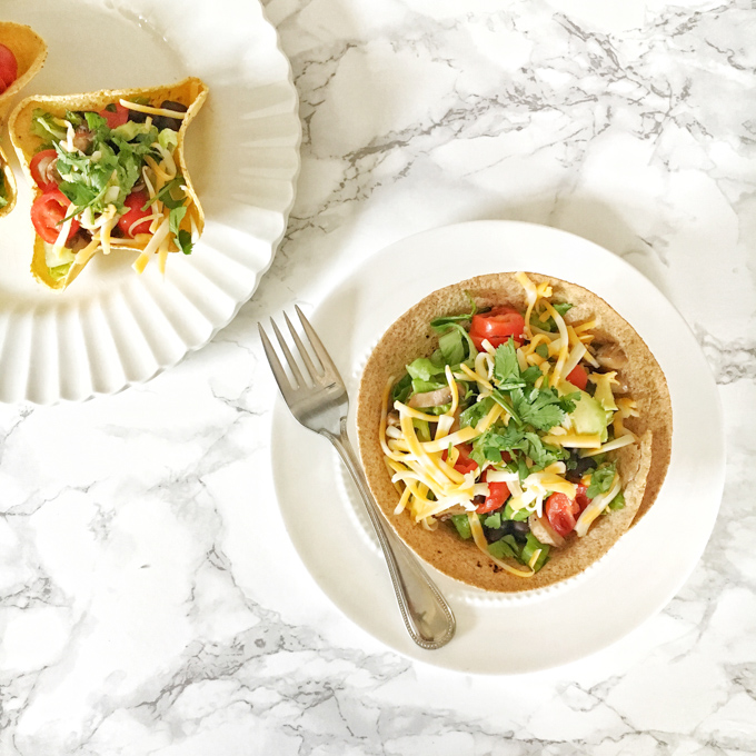 Make homemade taco bowls - with corn or flour tortillas - in your oven in 10 minutes! For this and more Healthy Kitchen Hacks, visit teaspoonofspice.com
