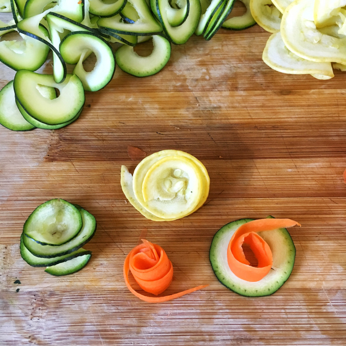 A crowd-pleasing appetizer made with hummus, puff pastry, zucchini, squash and carrots - recipe at Teaspoonofspice.com