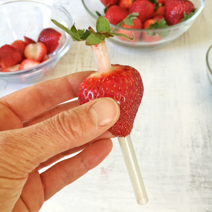 Try this easy trick to remove strawberry hulls with less food waste! Healthy Kitchen Hack at Teaspoonofspice.com