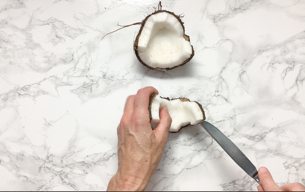 Here are the best ways to open young and mature coconuts - without any fancy tools! Healthy Kitchen Hacks at Teaspoonofspice.com
