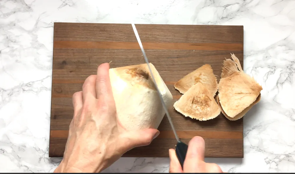 Here are the best ways to open young and mature coconuts - without any fancy tools! Healthy Kitchen Hacks at Teaspoonofspice.com