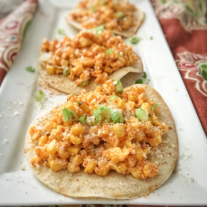 The famous grilled Mexican street corn meets eggs and tortillas in this breakfast mash-up recipe. Recipe at TeaspoonofSpice.com