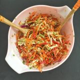 This refreshing slaw features jicama, carrots, cabbage, cucumbers and bell peppers - a perfect side dish for almost any meal. Recipe at Teaspoonofspice.com