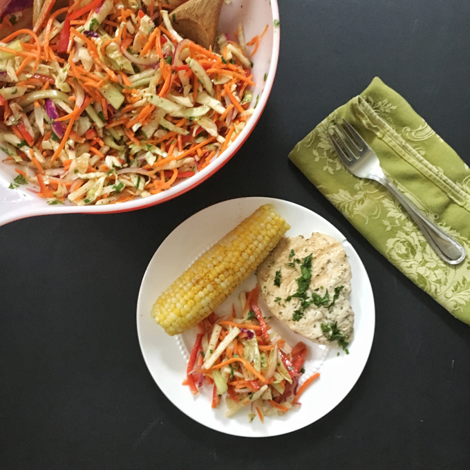 This refreshing slaw features jicama, carrots, cabbage, cucumbers and bell peppers - a perfect side dish for almost any meal. Recipe at Teaspoonofspice.com