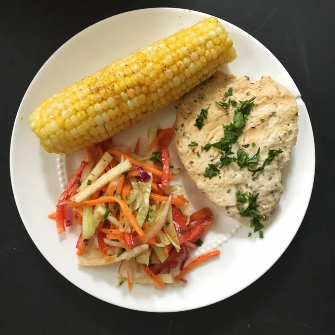 This refreshing slaw features jicama, carrots, cabbage, cucumbers and bell peppers - a perfect side dish for almost any meal. Recipe at Teaspoonofspice.com