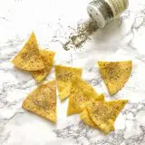 You can make tortilla snack chips at home in your oven or microwave. Check out our hacks for salted, ranch and nacho cheese flavors! Recipes at Teaspoonofspice.com