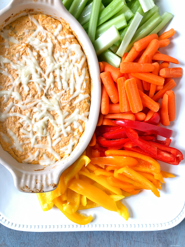 This buffalo chicken cheese dip is a crowd-pleaser and no one will miss the extra calories from the original. Recipe at Teaspoonofspice.com