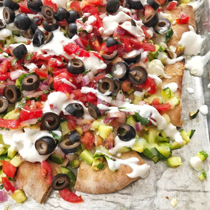 Use up that summer zucchini in this better-for-you nacho recipe with a Greek twist. Recipe at Teaspoonofspice.com
