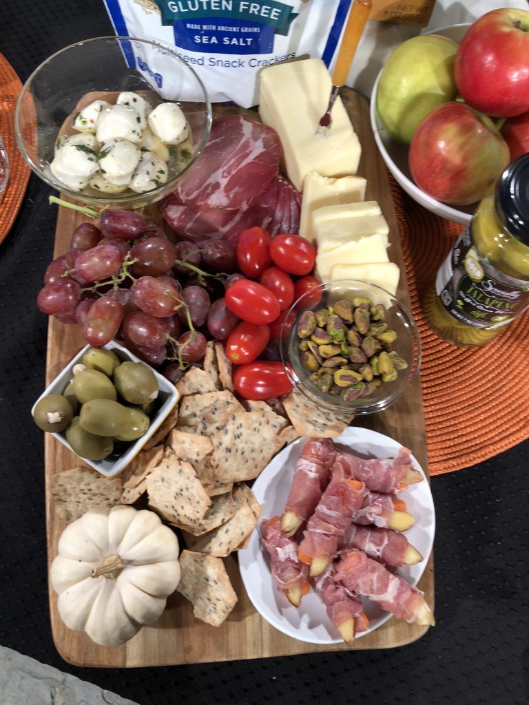 Add meats, cheeses, crackers, nuts, fruit and veggies to make a seasonal charcuterie board. #sponsored #aldi #halloween